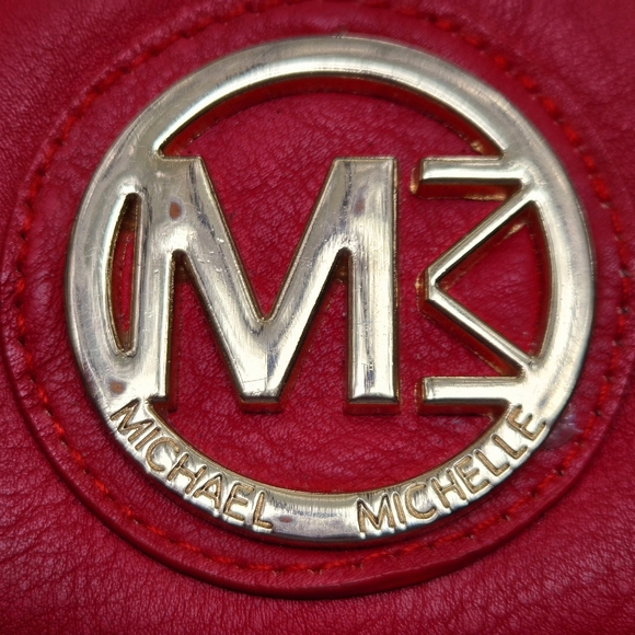 Red wallet with 2 zipper compartments and a wrist handle. - Picture 2 of 12